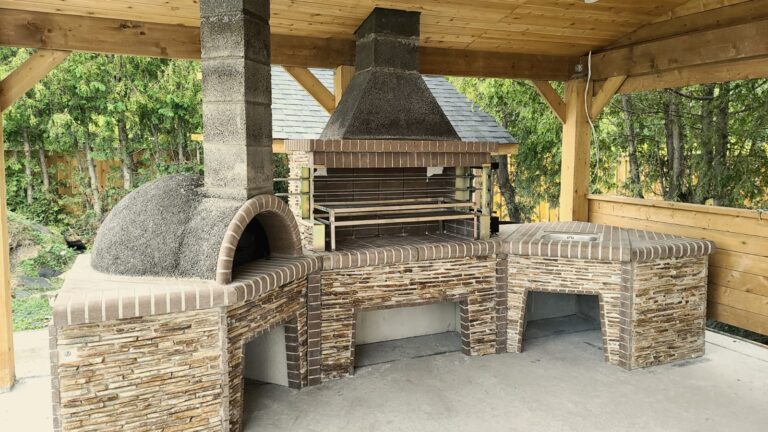 Outdoor Stone Kitchen With Firebrick Pizza Oven and Large Rotisserie bbq